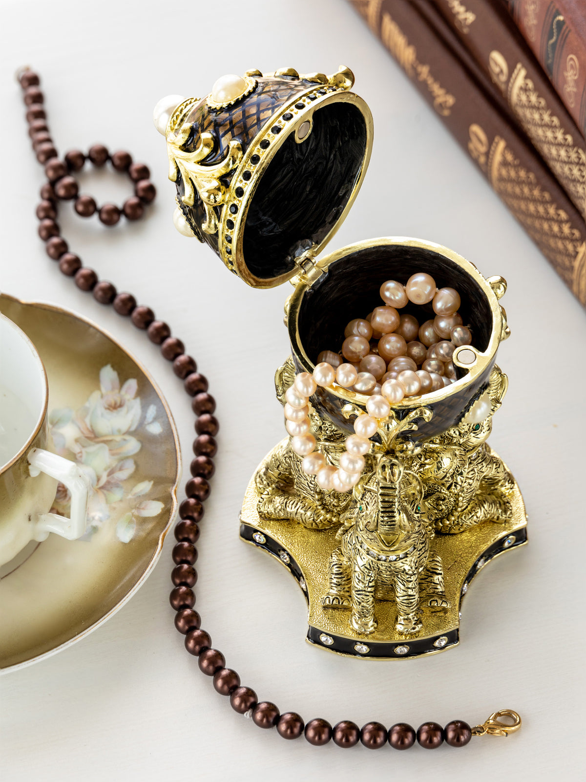 Keren Kopal Regal Brown and Gold Enamel Egg with Elephant Pedestal