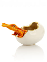 Orange Crocodile hatching from egg