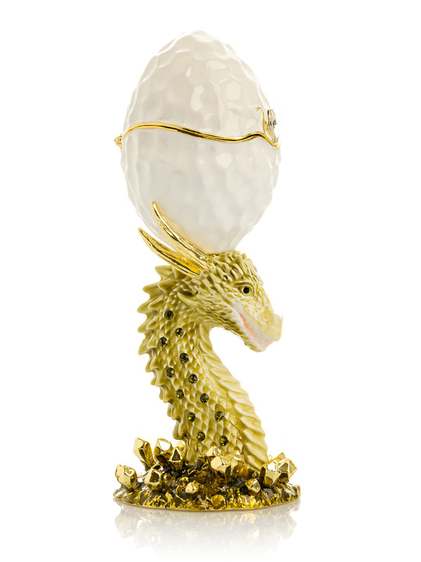 Tête de dragon doré œuf blanc