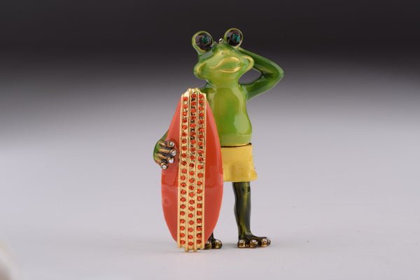 Grenouille tenant une planche de surf