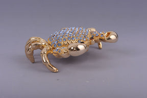 Golden Crab with blue stones