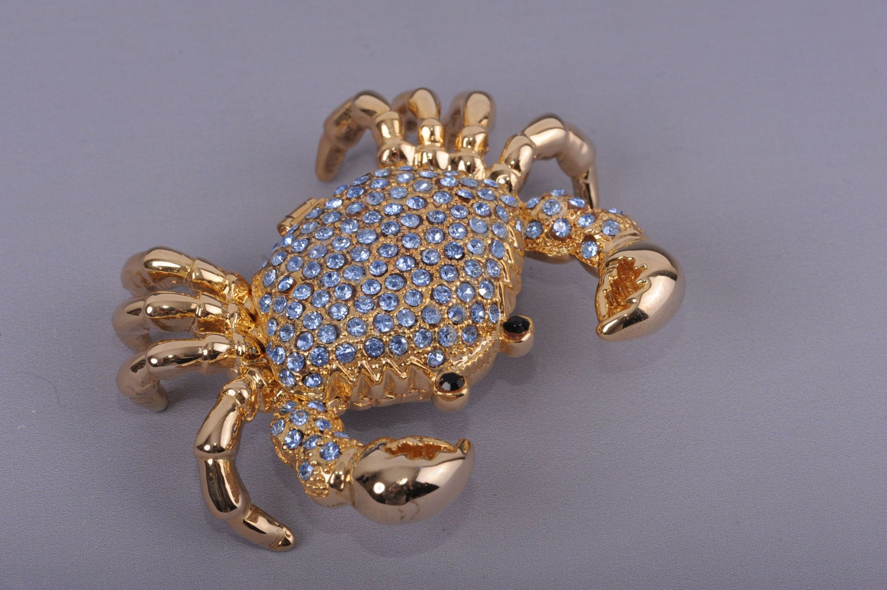 Golden Crab with blue stones