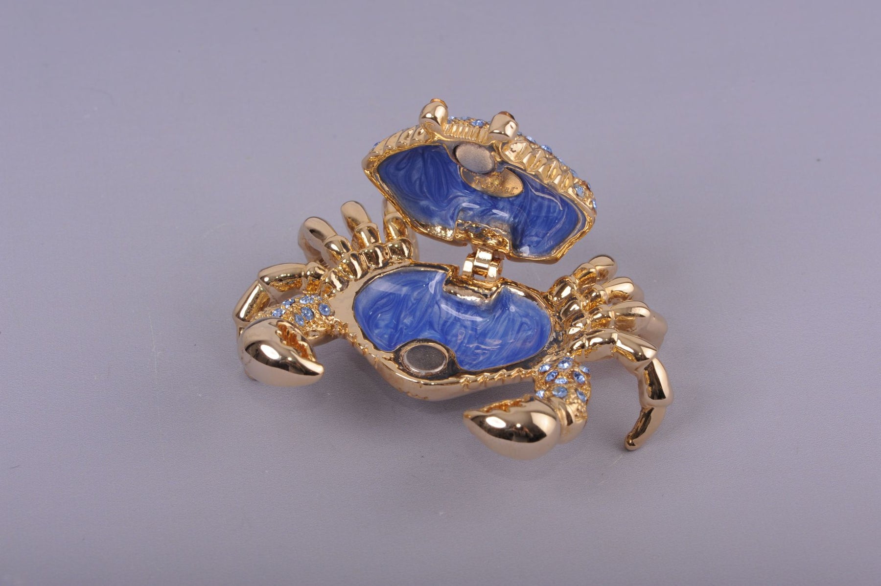 Golden Crab with blue stones