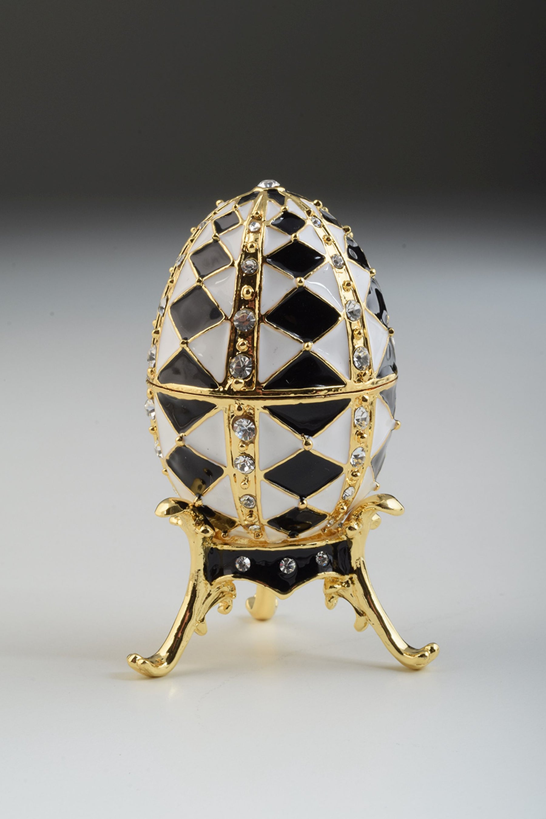 Black and White Faberge Egg with Gold Necklace Inside